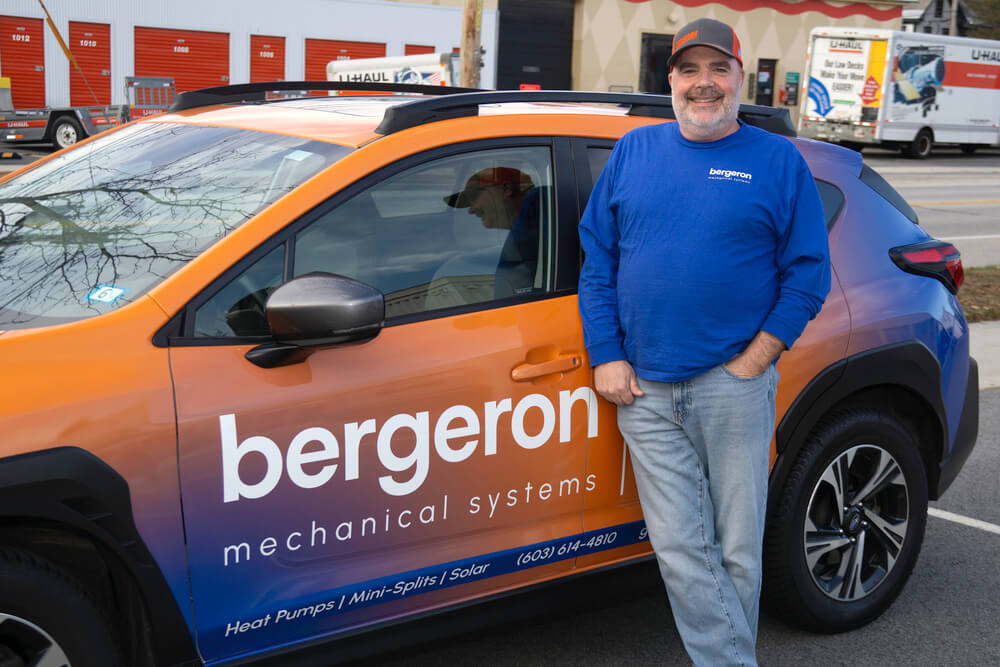 Technician with Bergeron vehicle mini-split installation