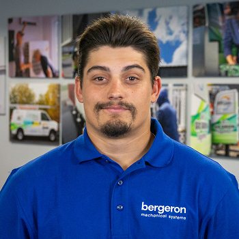 Vermont HVAC technician smiling indoors